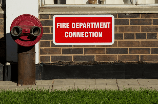 fdc sign in front of a building with an fdc next to it.