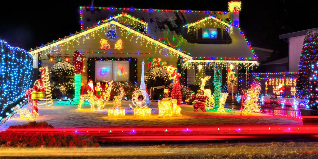 Front-on view of a house lit up by Christmas lights