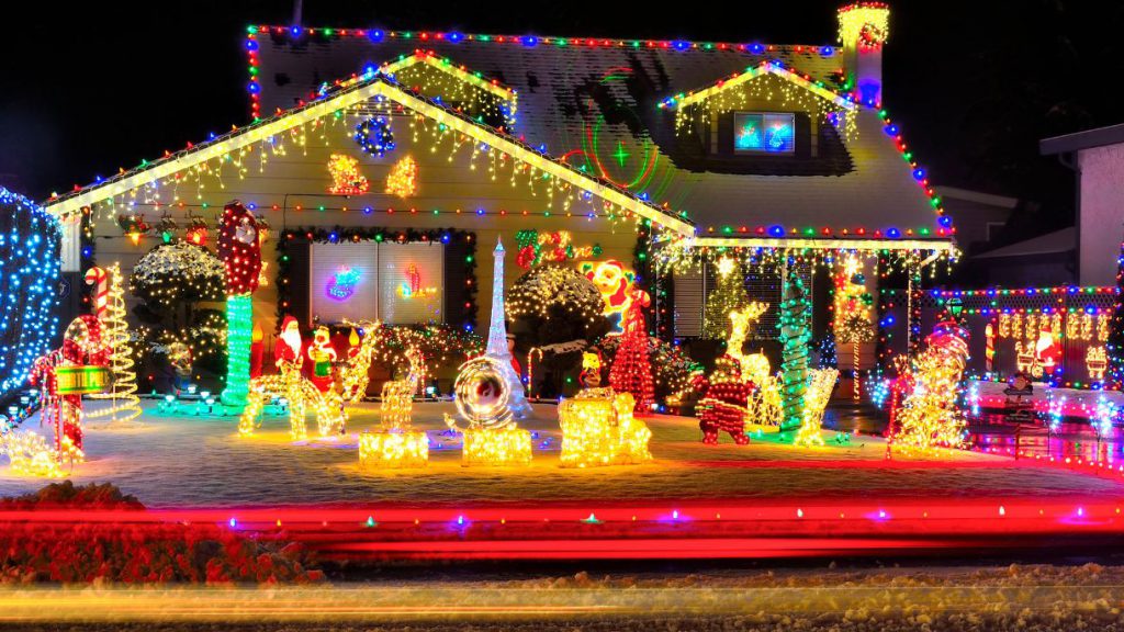 Front-on view of a house lit up by Christmas lights