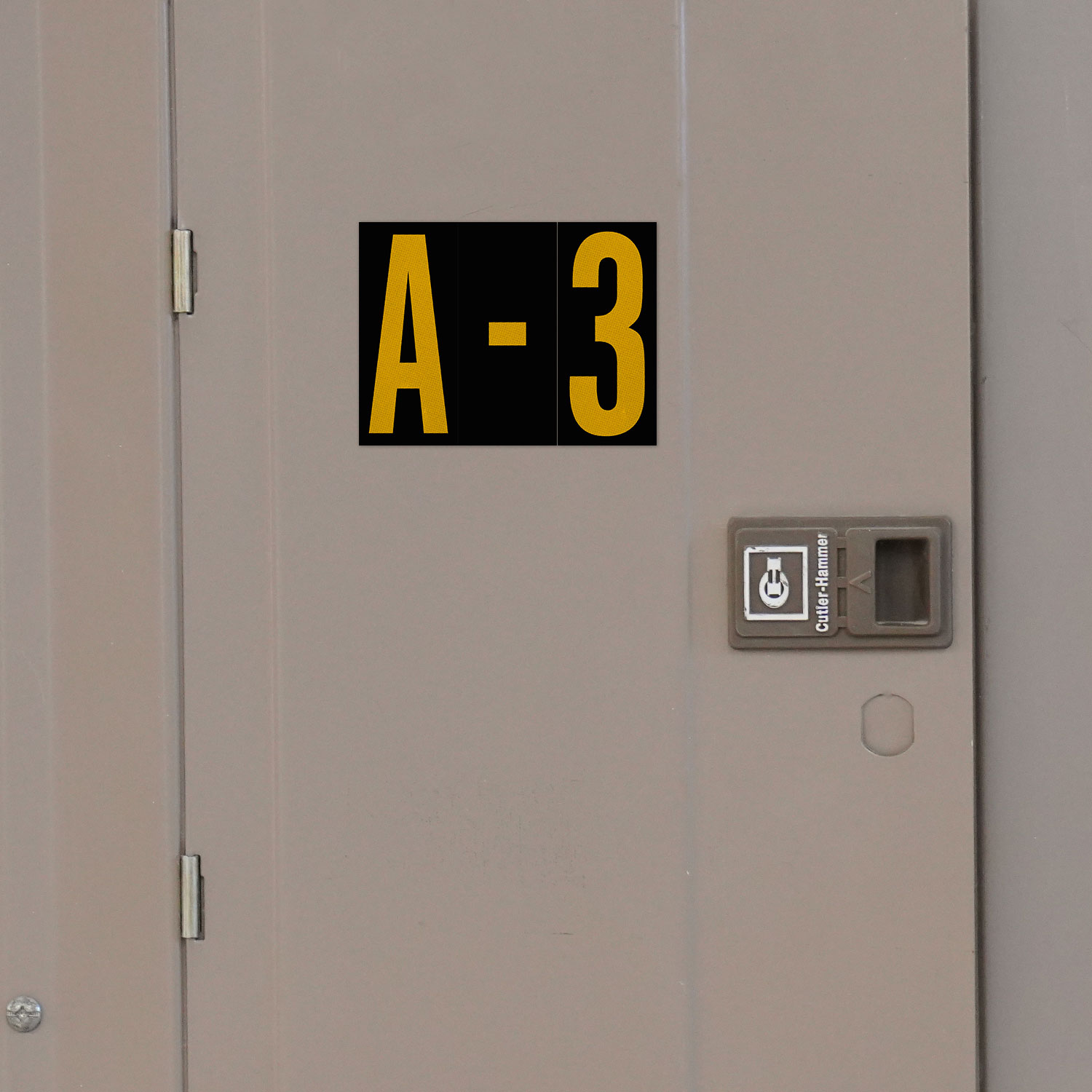 1.5" Yellow Character on Black EG Reflective Vinyl Label