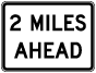 Texas 2 Miles Ahead Sign