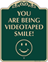 Green Background – Smile You Are Being Videotaped Sign