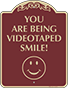 Burgundy Background – Smile You Are Being Videotaped Sign