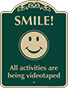 Green Background – Smile All Activities Are Being Videotaped Sign