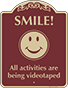 Burgundy Background – Smile All Activities Are Being Videotaped Sign