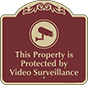 Burgundy Background – Protected By Video Surveillance Sign