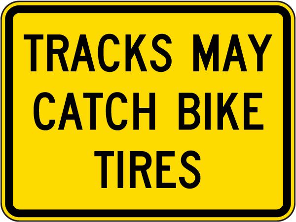 Tracks May Catch Bike Tires Sign