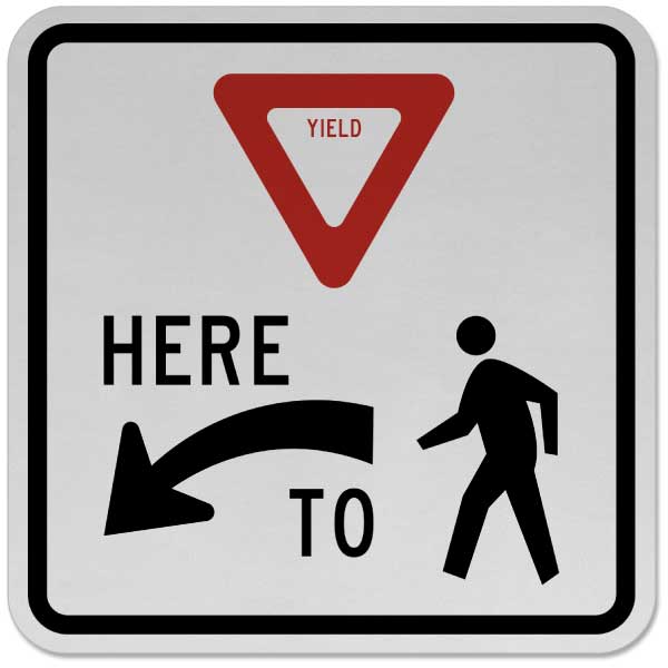Yield Here to Pedestrians Sign