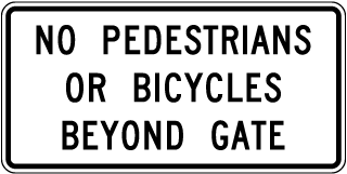 No Pedestrians Or Bicycles Beyond Gate Sign