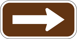 Brown / White Arrow Sign