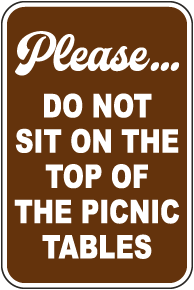 Please Do Not Sit On Top Of The Tables Sign
