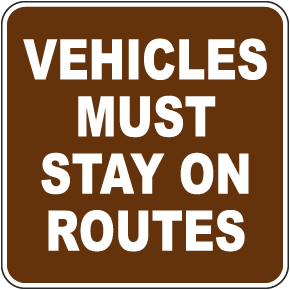 Vehicles Must Stay On Routes Sign