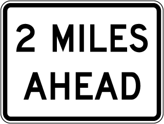 Texas 2 Miles Ahead Sign