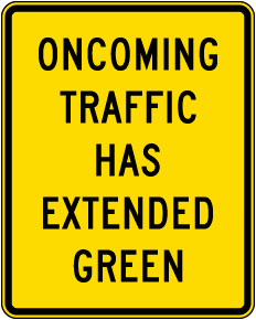 Oncoming Traffic Has Extended Green Sign