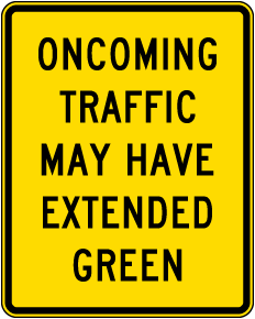 Oncoming Traffic May Have Extended Green Sign