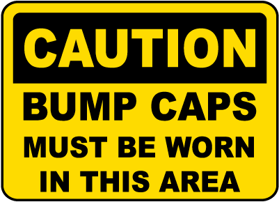 Caution Bump Caps Must Be Worn Sign