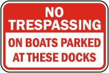 No Trespassing on Boats Parked Sign