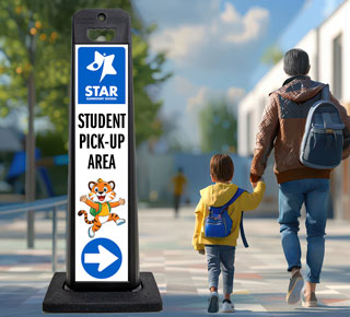 A parent and child walking next to a vertical panel.