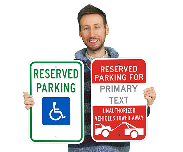 A man holding an ada compliant sign in one hand and a custom parking sign in the other.