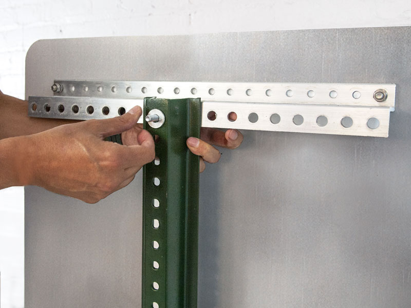 Mounting the z-bar on a u-channel post and securing with a nut