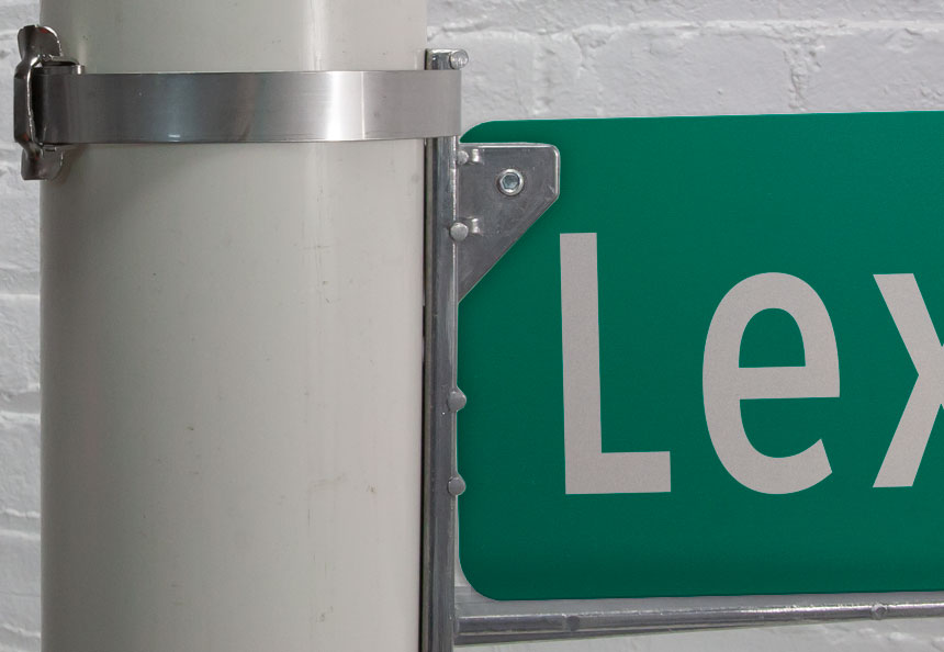 Street name sign on wing bracket