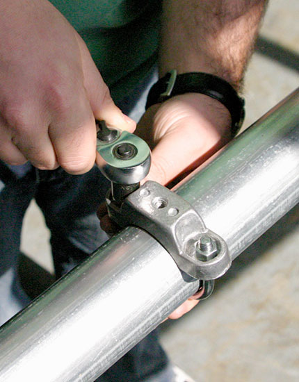 Tightening round post clamp with socket wrench